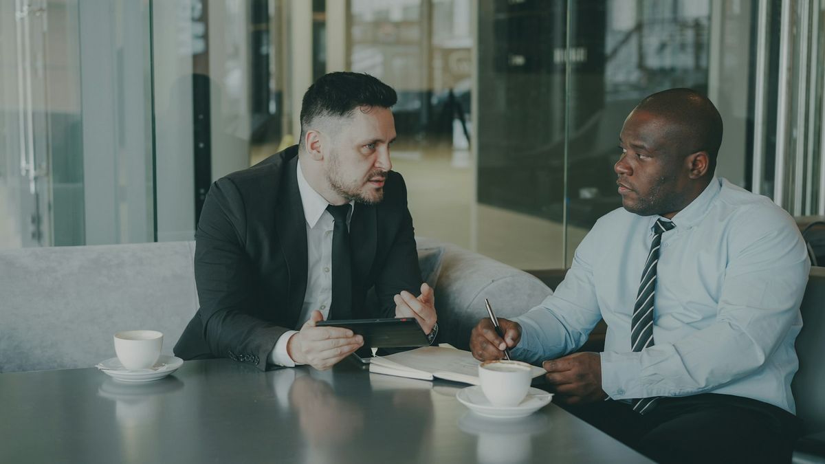 An agent reviewing numbers with a client