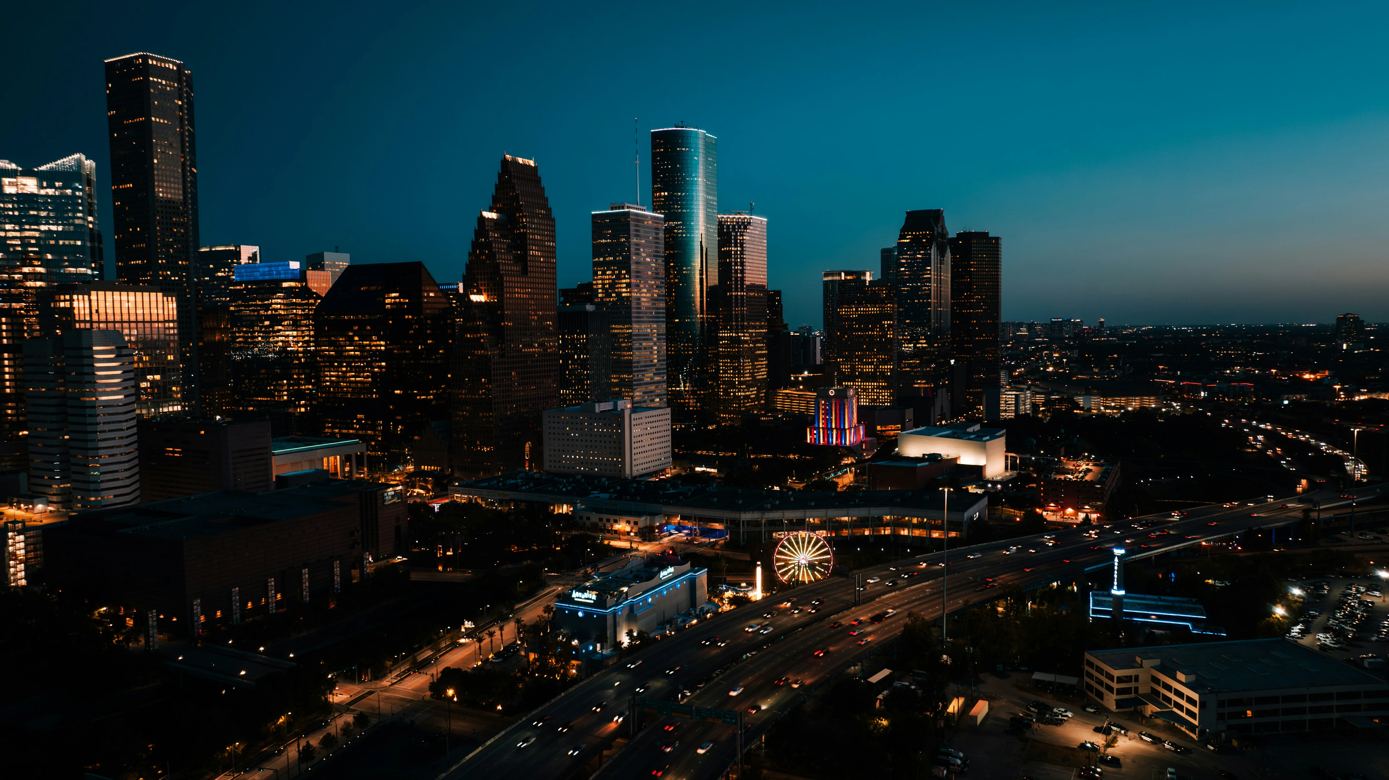 Aerial view of downtown Houston at night, the Texas market Vantage Real Estate Marketing serves
