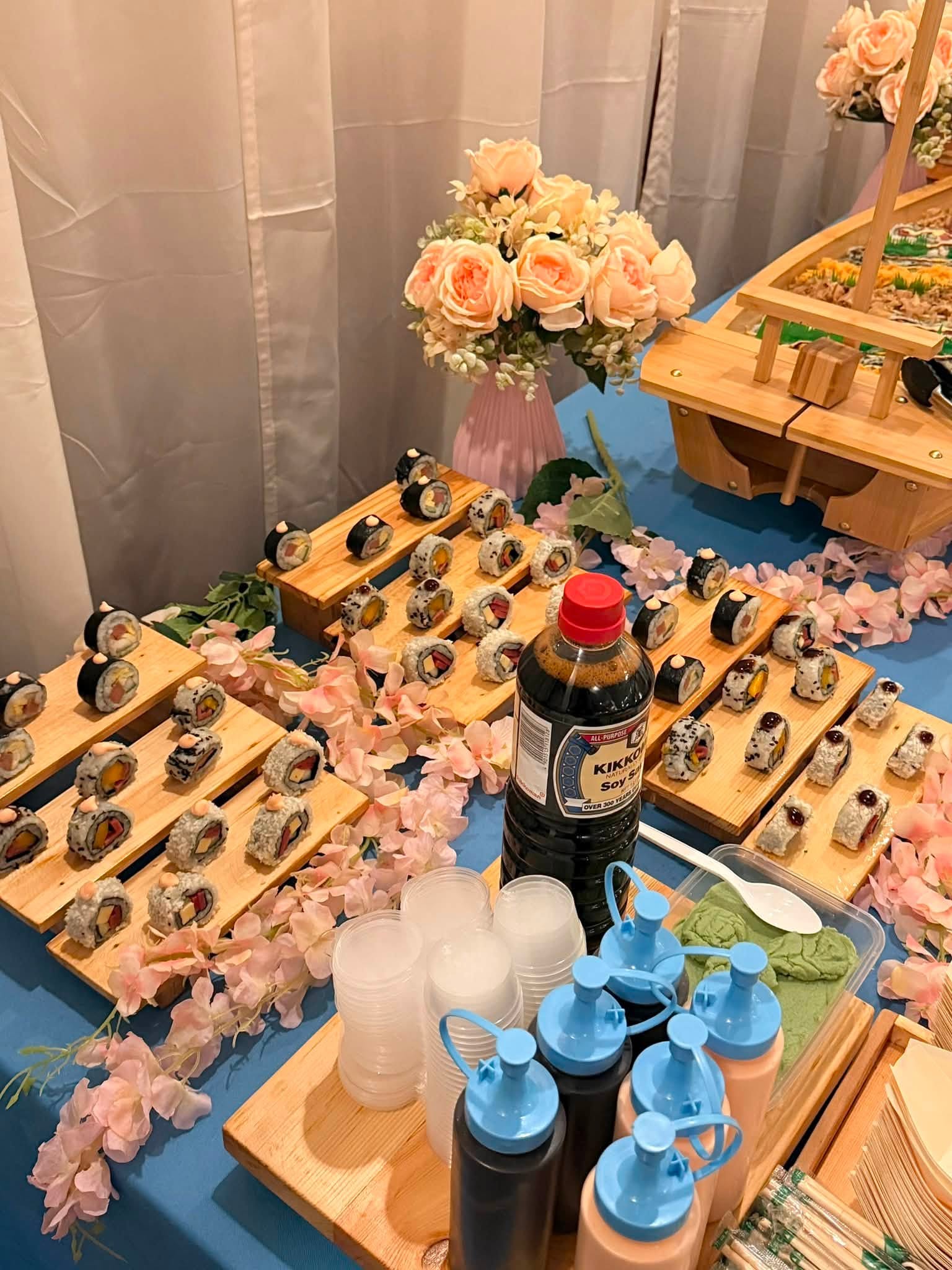 Maki trays with soy sauce and condiments ready for guests