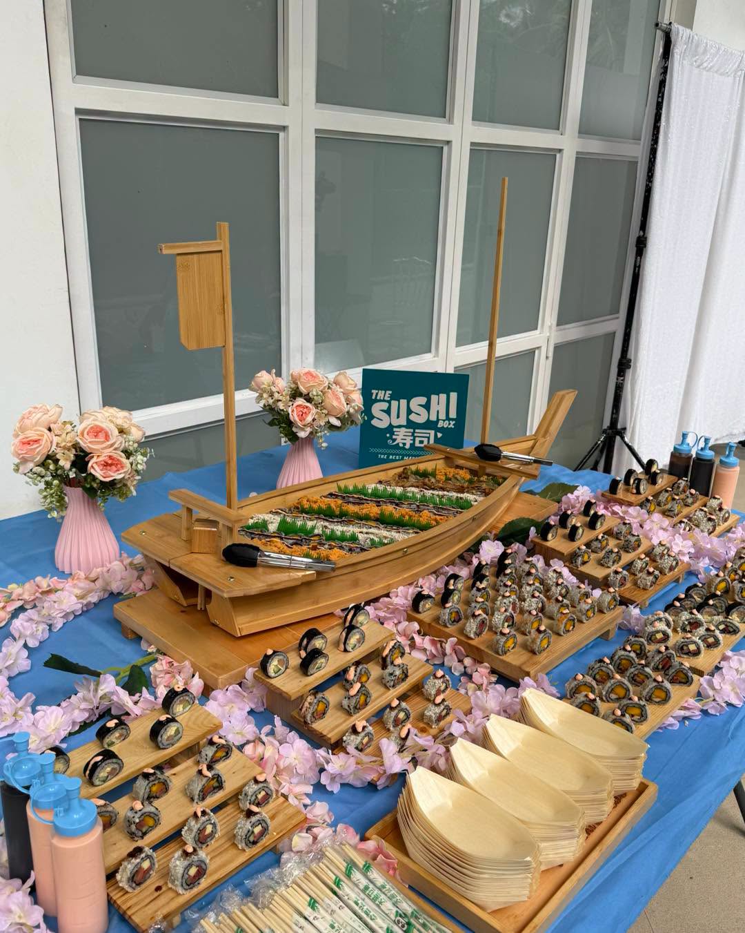 Sushi boat catering set up for an outdoor event