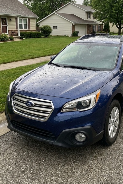 Hail damage repair Dallas TX professional technician removing hail dents using paintless dent removal