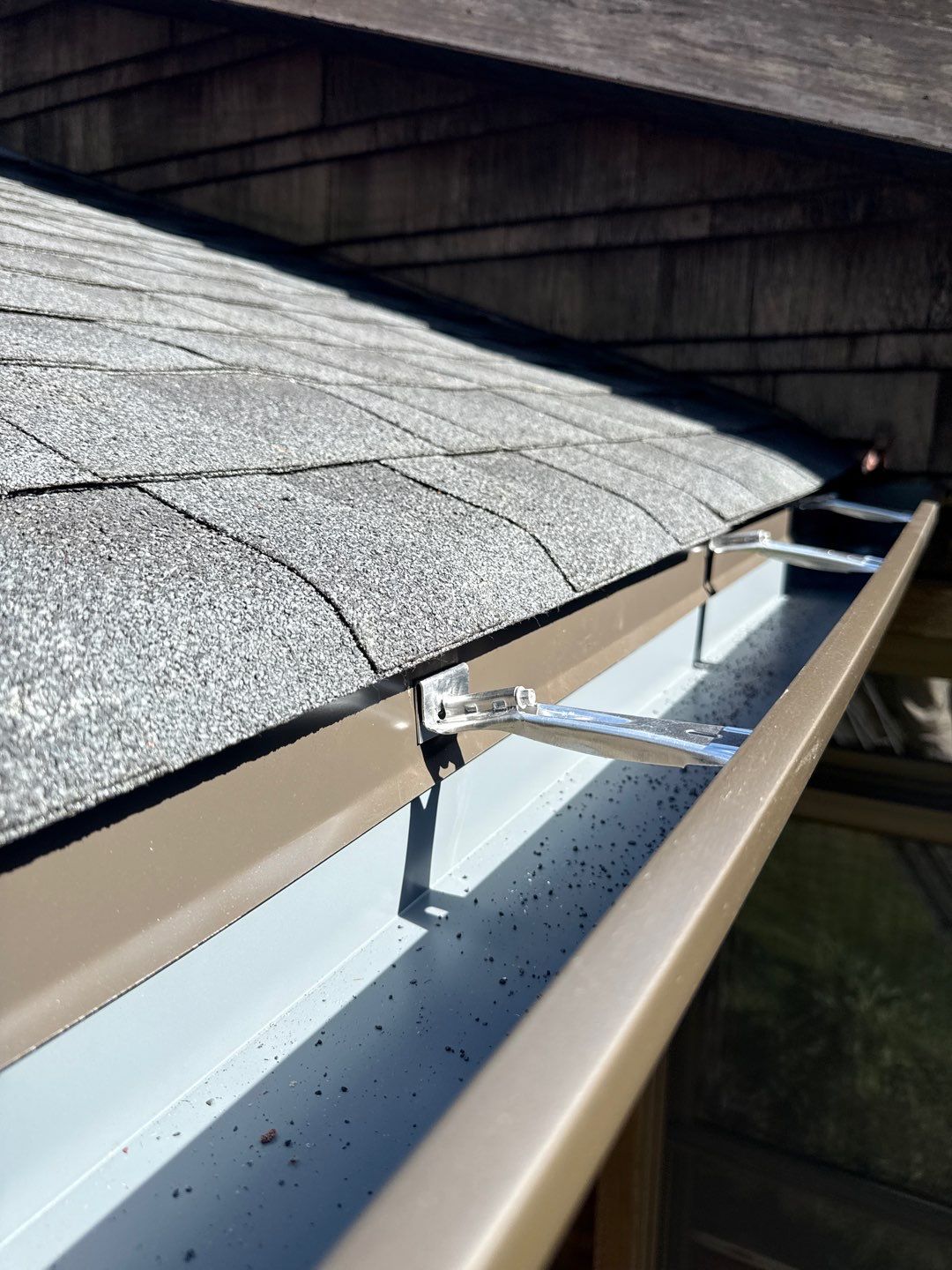 Gutter installed along a roof edge