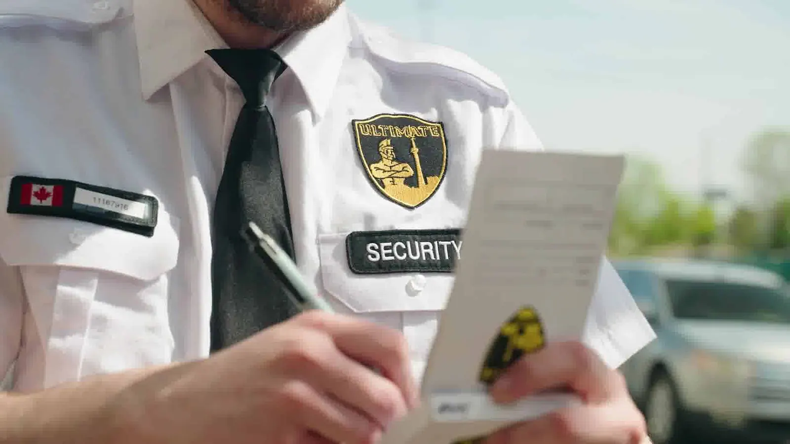 Close-up of an officer writing up a report