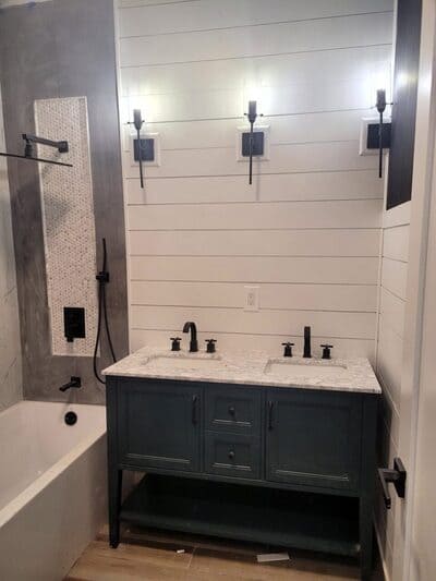 Dual sink vanity with shiplap walls