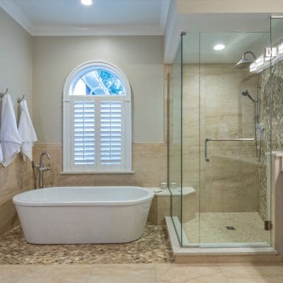 high-end glass shower next to bathtub