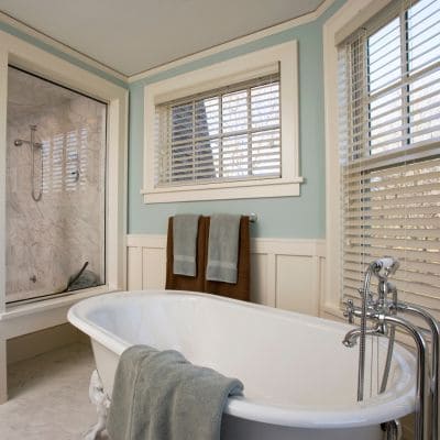 Modern bathroom remodel featuring a freestanding tub and glass shower