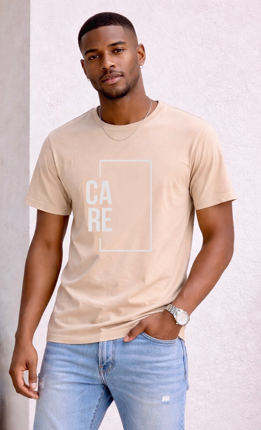 Man wearing the sand CARE tee with a white design