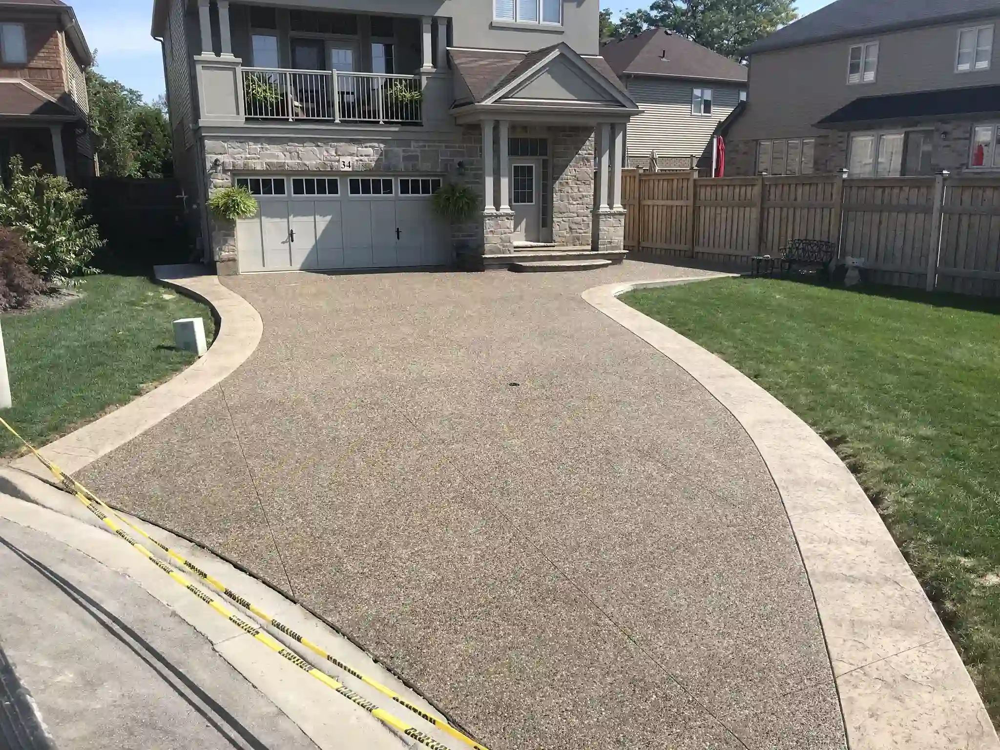 Custom concrete driveway border detail by SCP Stamped Concrete Pros Inc. in Hamilton, Ontario