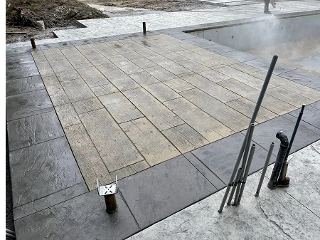 Decorative concrete outdoor patio with custom curved layout