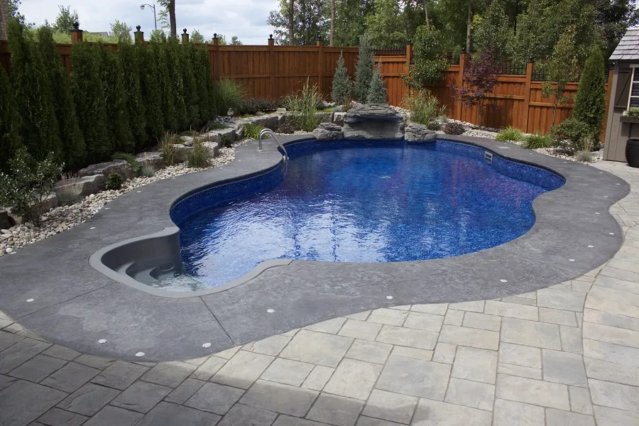 Concrete patio and pool deck in Hamilton by SCP Stamped Concrete Pros Inc.
