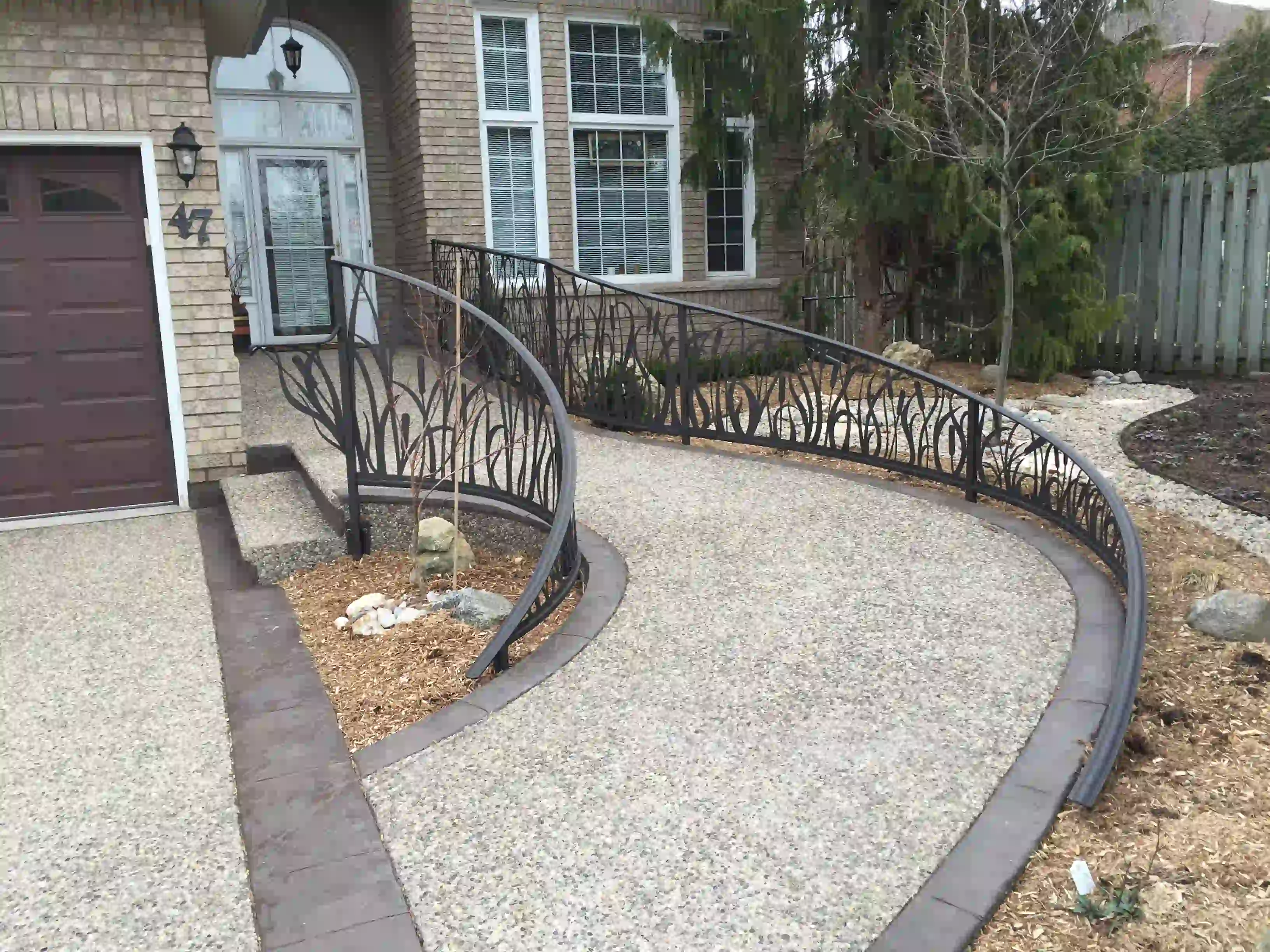 Concrete walkway by SCP Stamped Concrete Pros Inc.