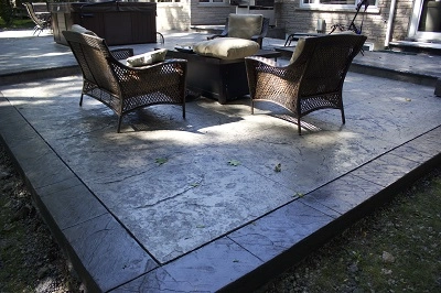 Outdoor kitchen design and concrete patio by SCP Stamped Concrete Pros Inc.