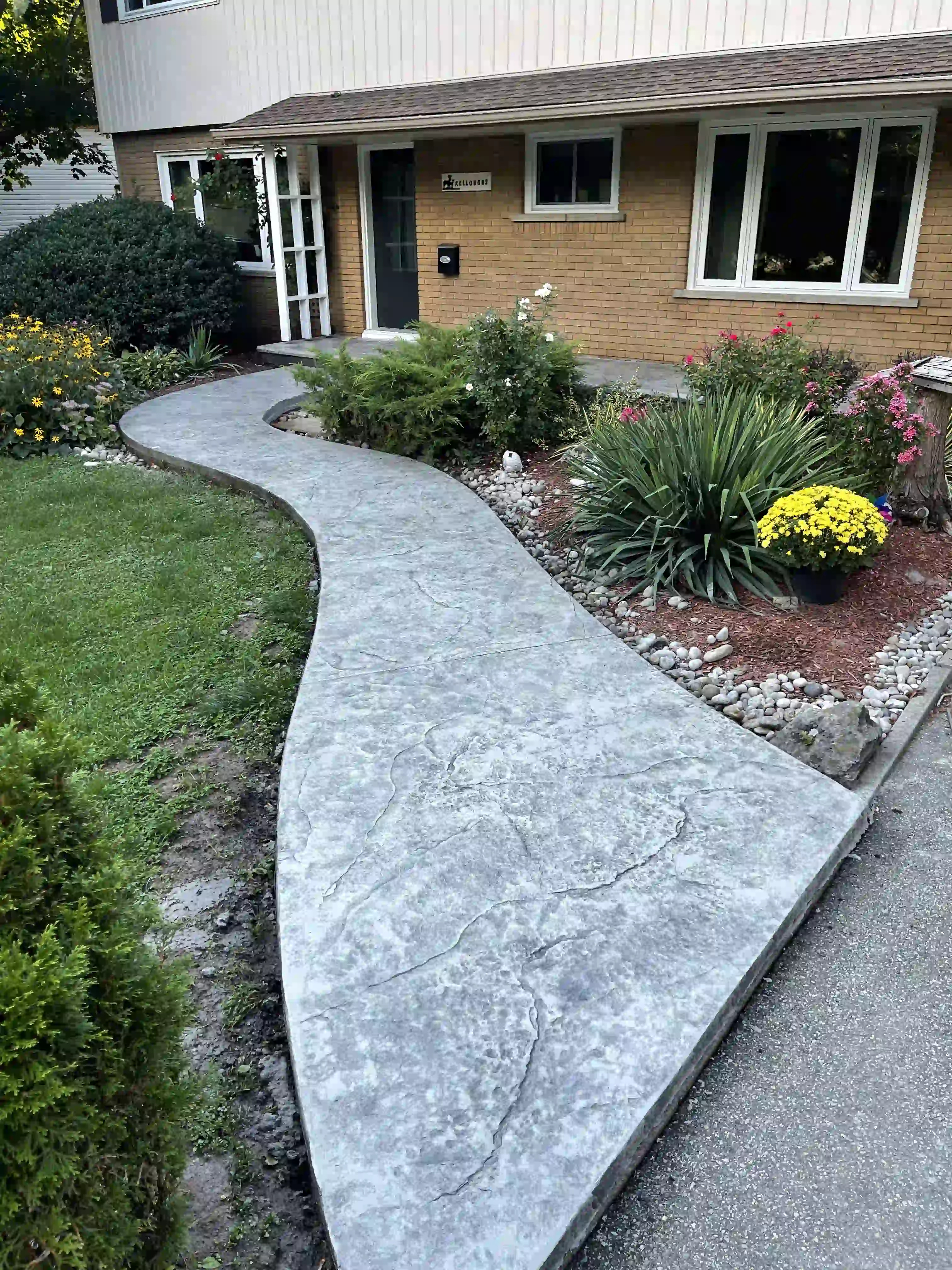 Decorative concrete outdoor patio with custom curved layout