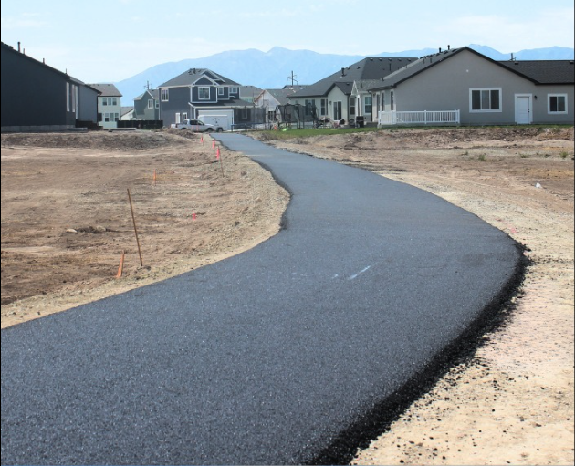 Smooth paved walking path through a Utah park