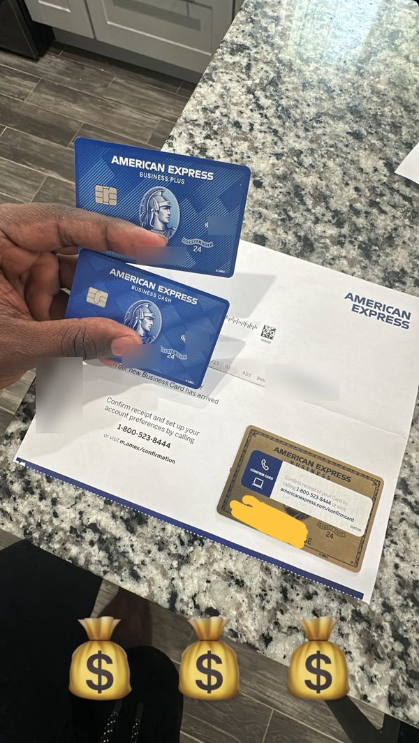 Photo of three new business credit cards with the welcome letter