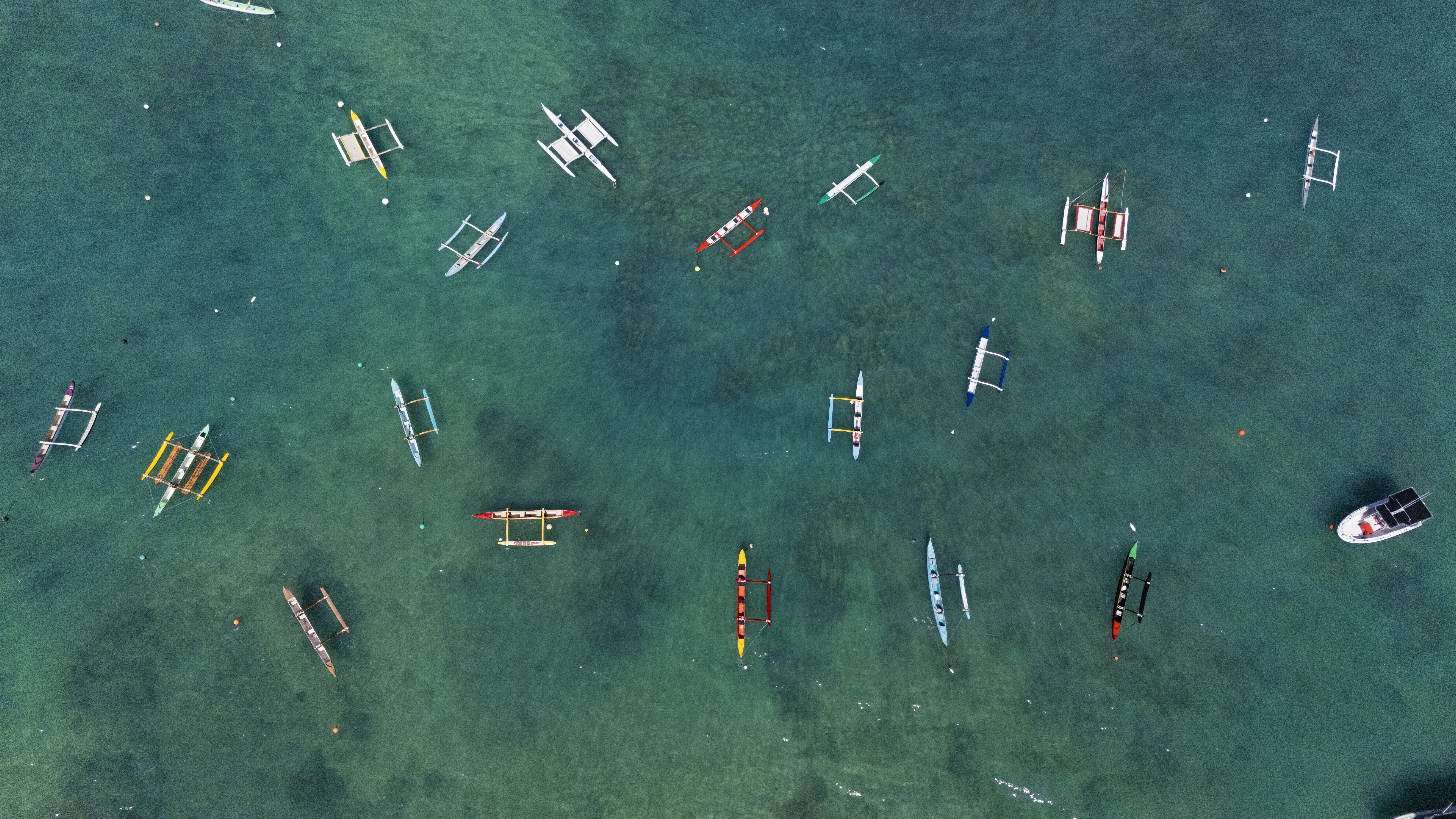 Drone photography of canoes in Waikiki. 