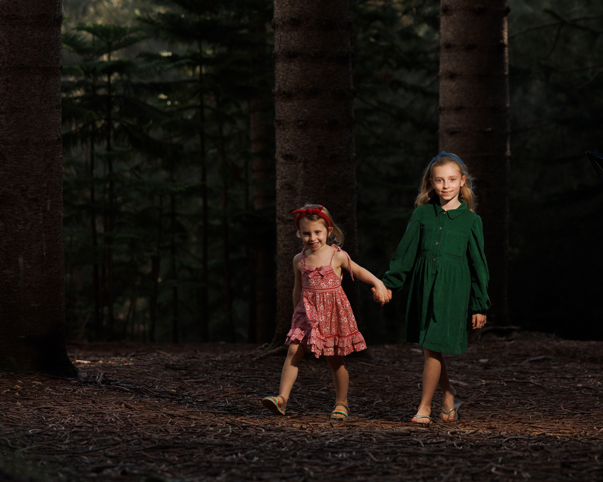 Girls walk in a forest in Honolulu. 