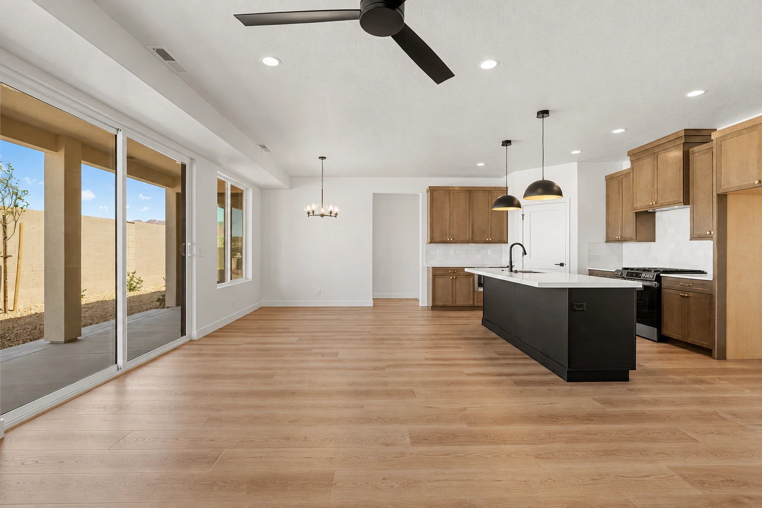 Marigold open living room and kitchen with wood cabinetry and island