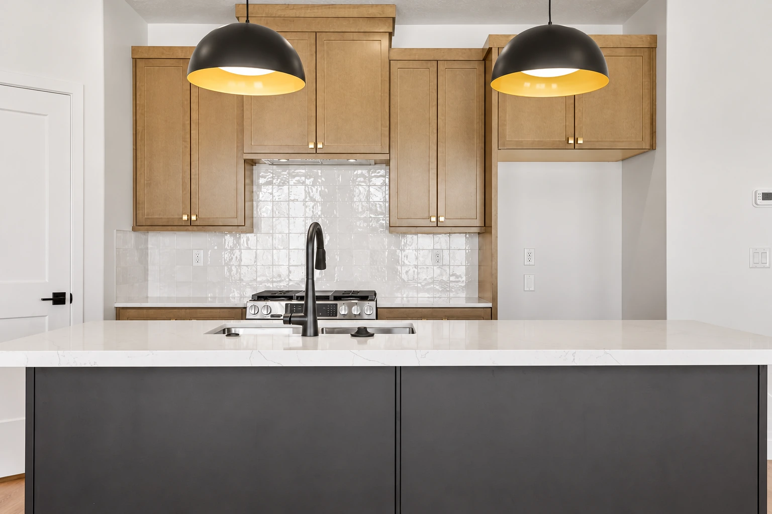 Marigold kitchen island, pendant lights and wood cabinetry