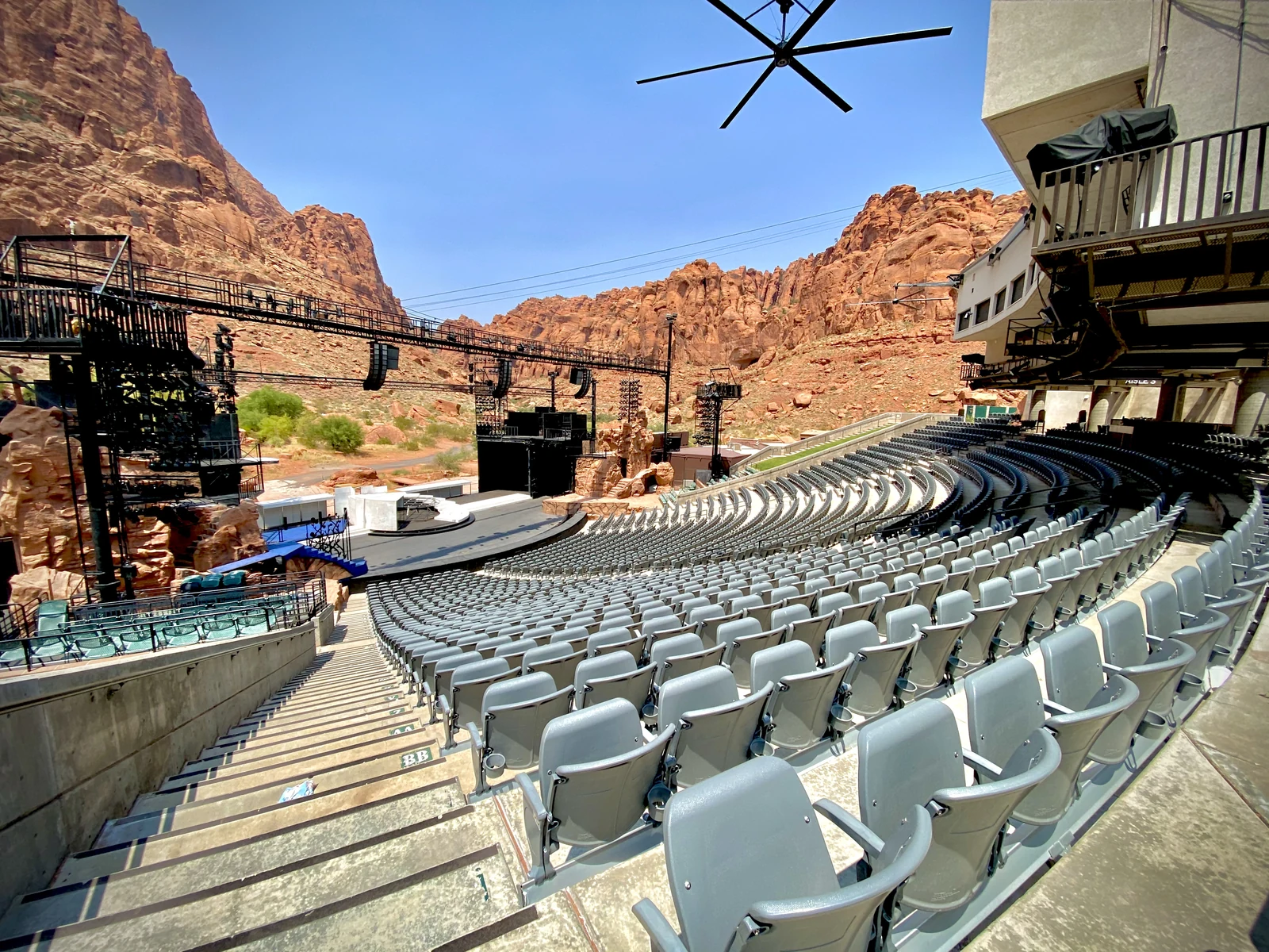 Tuacahn outdoor amphitheatre seating and stage beneath the red-rock canyon walls, photographed by Drdrewwilliams