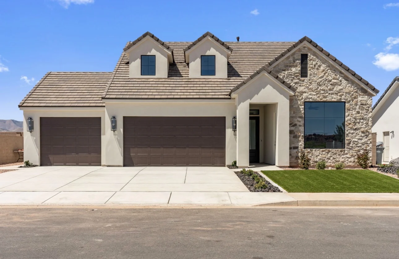 Sunflower home at Pioneer Pointe with stone facade and three car garage