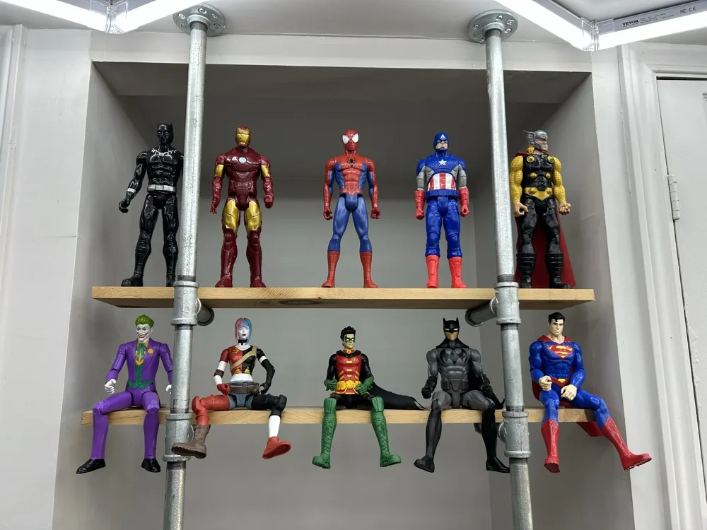 Superhero figures display at 519 Barbershop