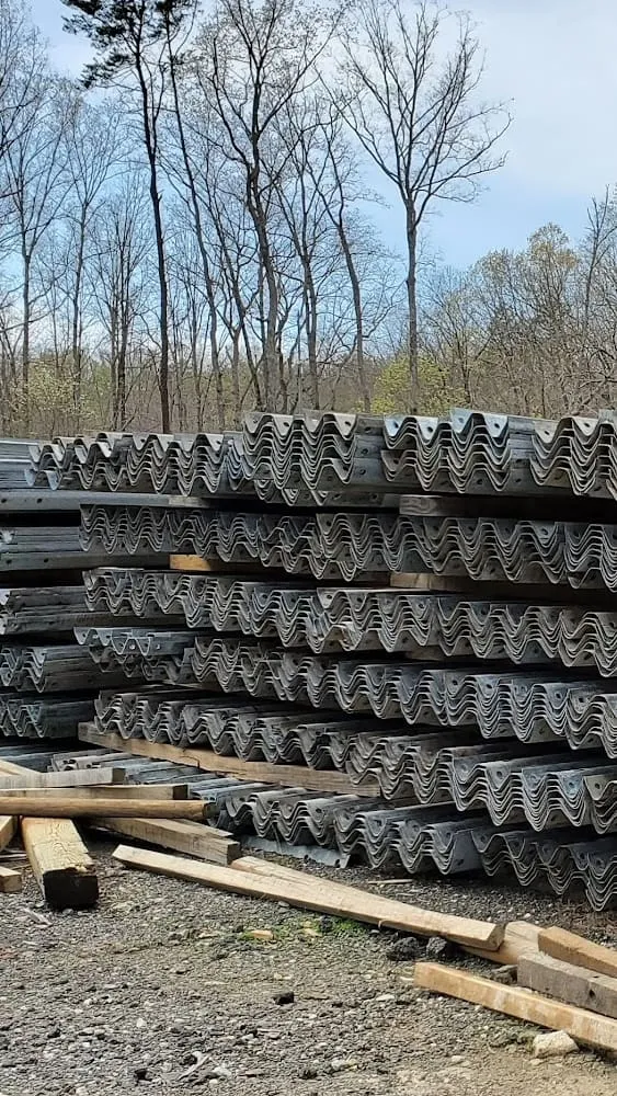 Stacks of used W-beam guardrail