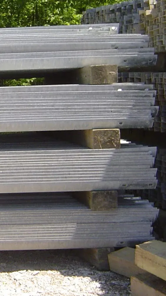 Stacks of used thrie-beam guardrail