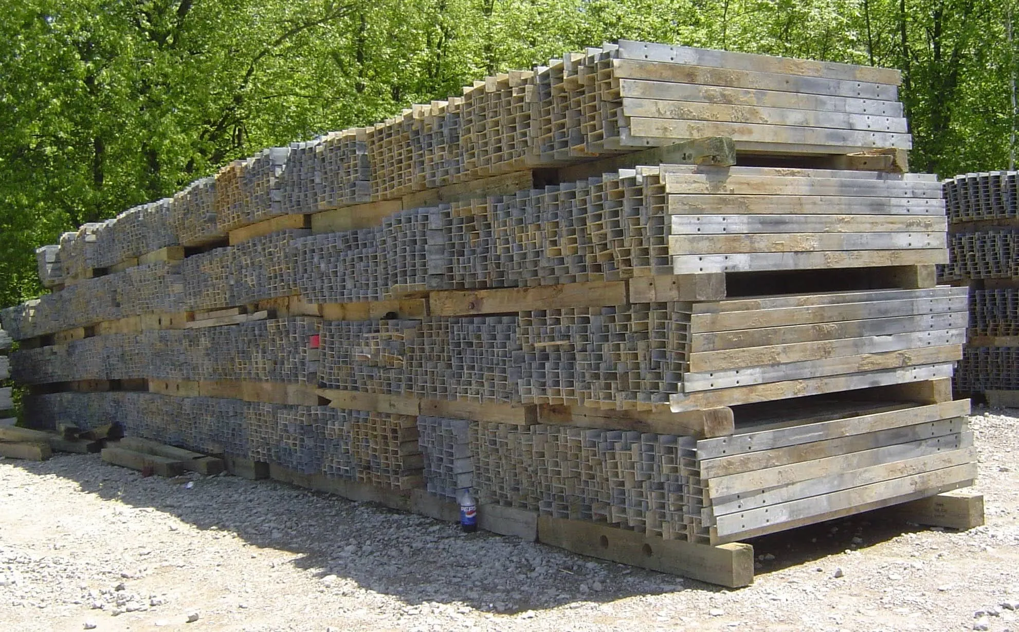 Galvanized I-beam posts stacked on pallets