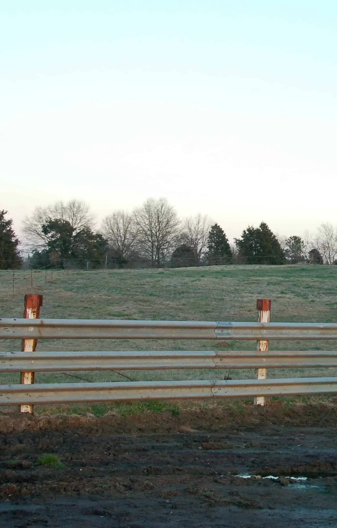 Pasture fence built from W-beam guardrail