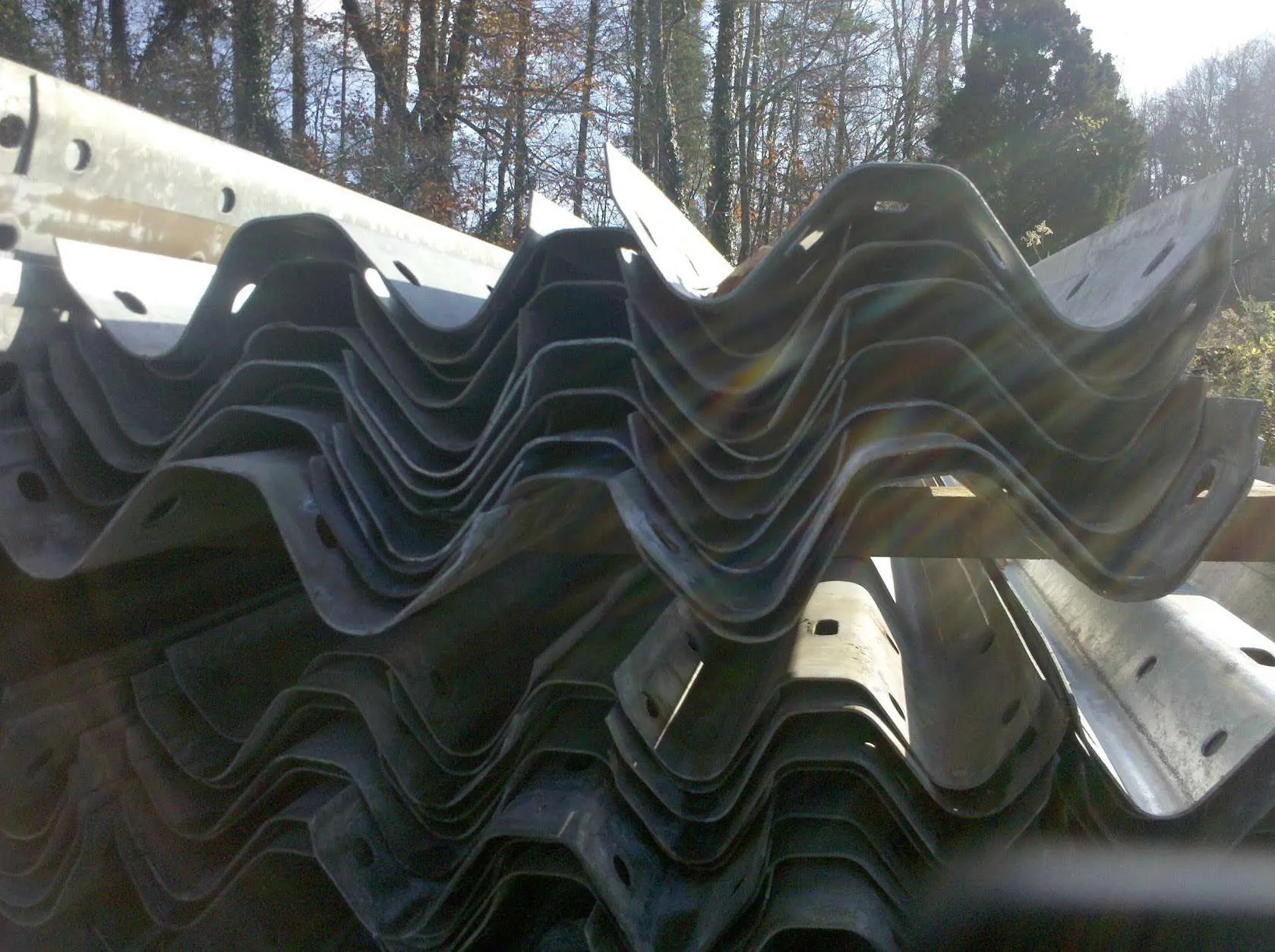 Close-up of nested used W-beam guardrail panels