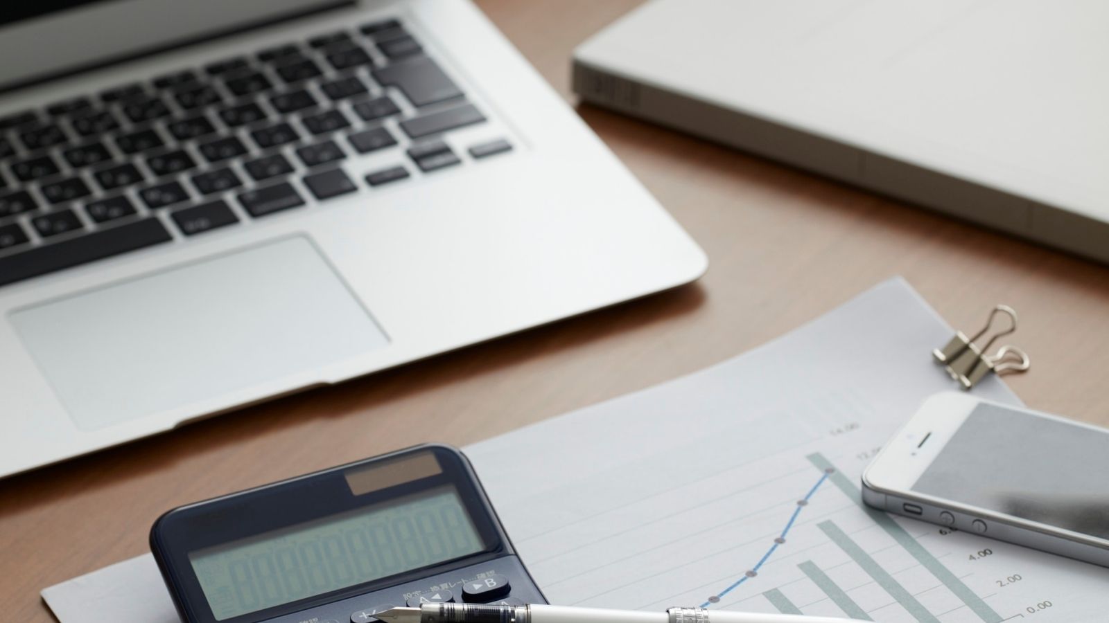 Small business owner reviewing insurance and financial documents. Small business owner reviewing insurance and financial documents.