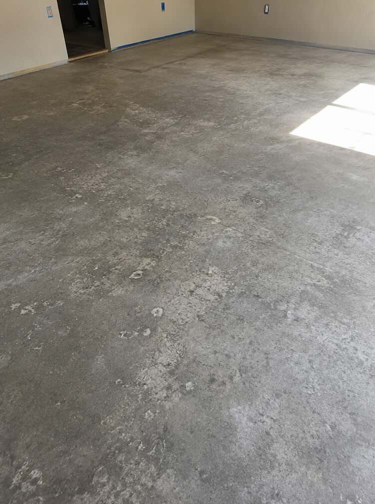 Cracked bare concrete before metallic epoxy — Santa Rosa 2-car garage