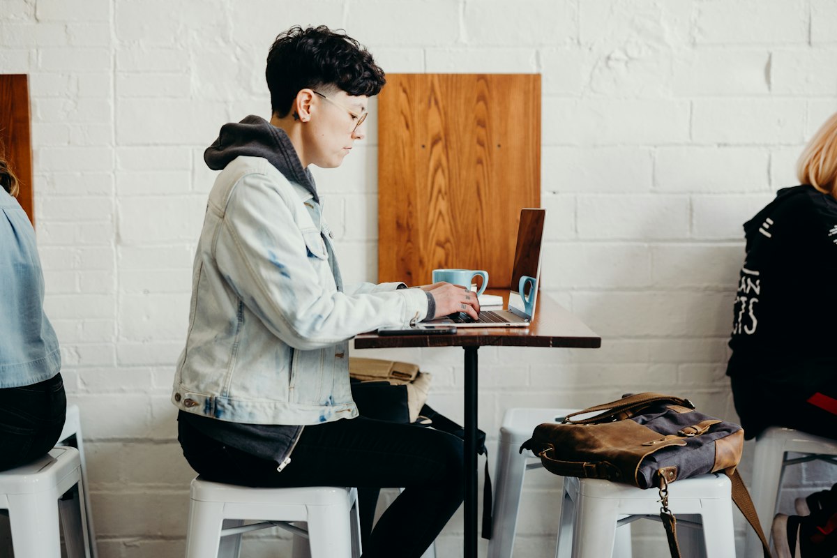 Two colleagues working together on a laptop