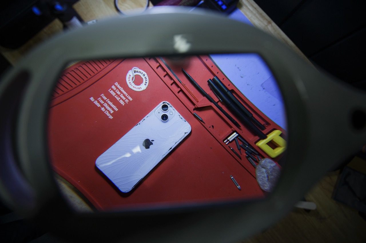 Phone repair technician working on a device at the Redding Smart Repair workbench