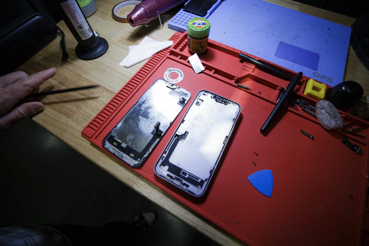 Disassembled device and repair tools at the Redding Smart Repair shop