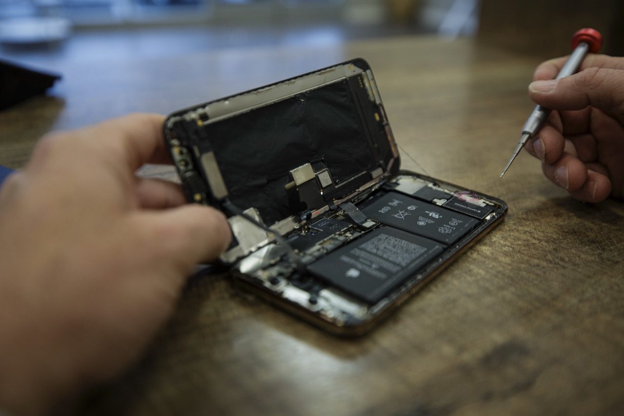 Workbench with magnification tools for phone repair in Redding, CA