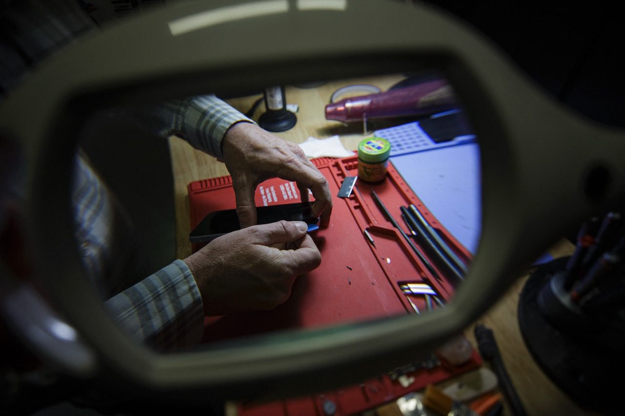 Phone repair tools and parts laid out at Redding Smart Repair