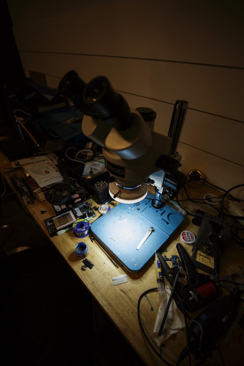 Precision phone repair work under magnification at Redding Smart Repair