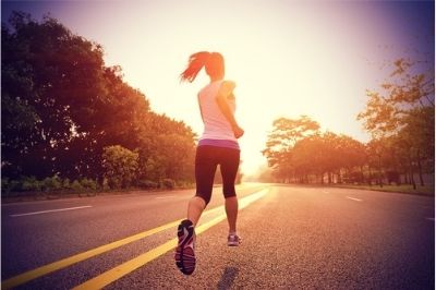 woman running at sunrise
