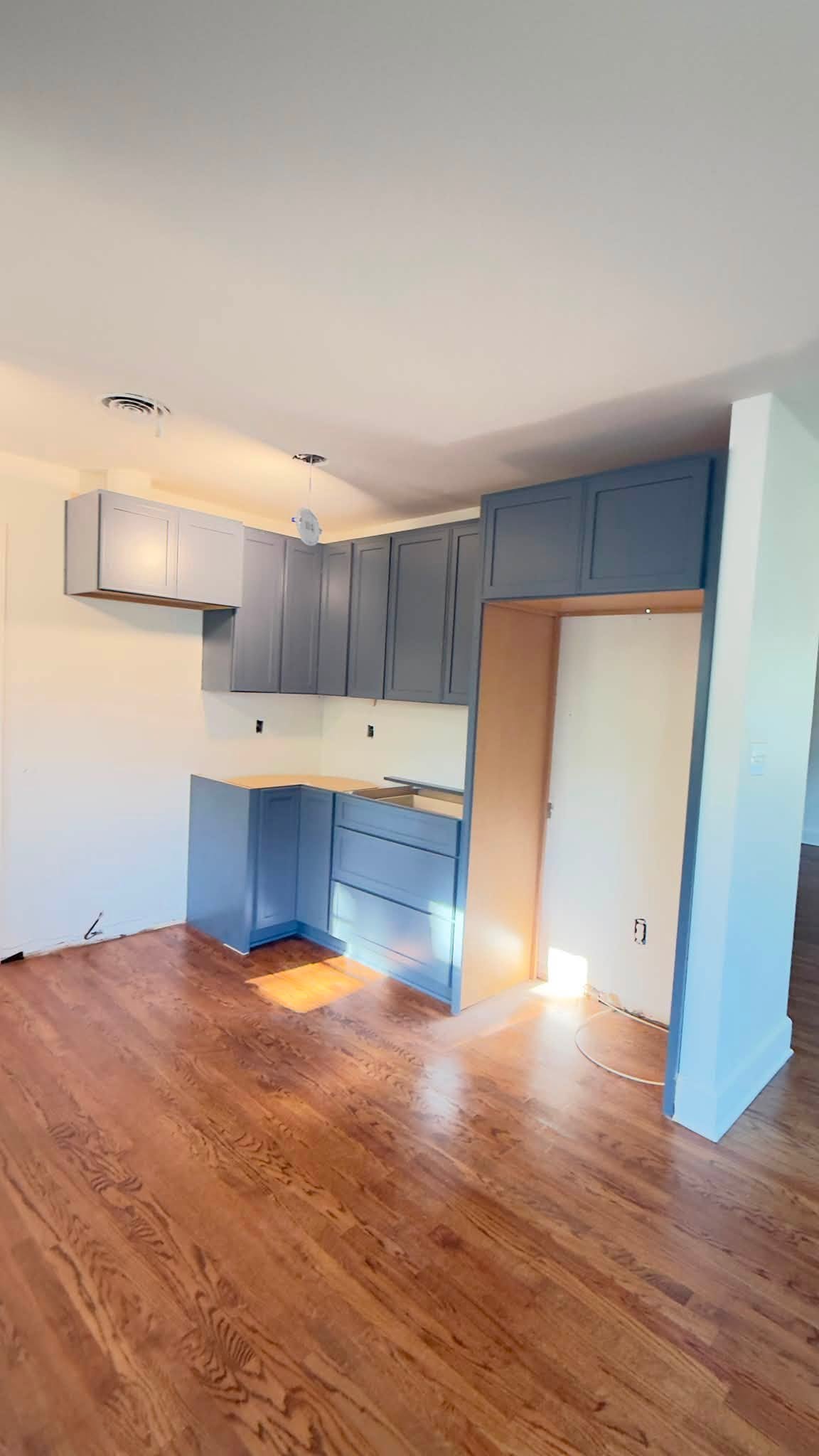 Modern kitchen remodeling project by Paiz Restoration LLC