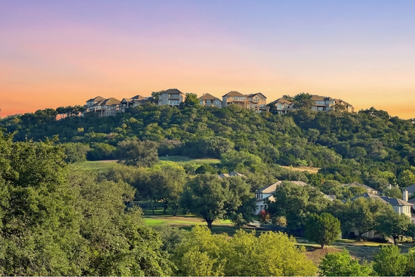 River Place Austin neighborhood with hillside homes, mature trees, and scenic hill country surroundings