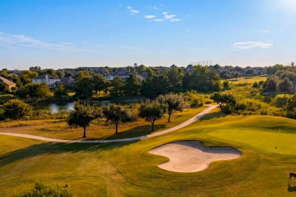 Teravista Round Rock neighborhood with golf course homes, sidewalks, and master-planned suburban community