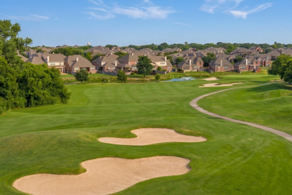 Forest Creek Round Rock neighborhood with golf course homes, mature trees, and established residential streets