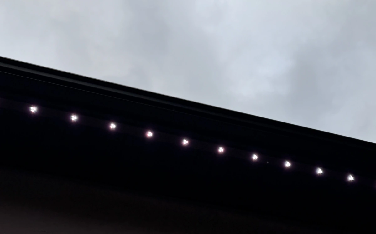Close-up of permanent LED lights mounted along a roofline