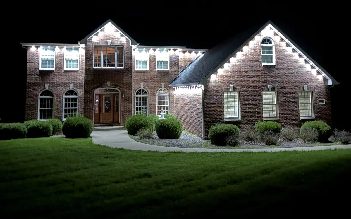 Home lit in pink permanent LED lighting at dusk