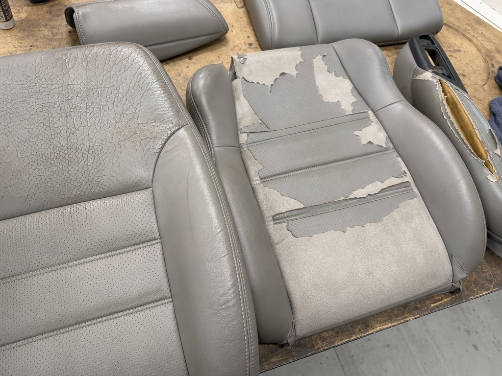 Car seat leather damage types — cracked bolster and peeling bonded leather | My Upholstery Guys Fort Worth