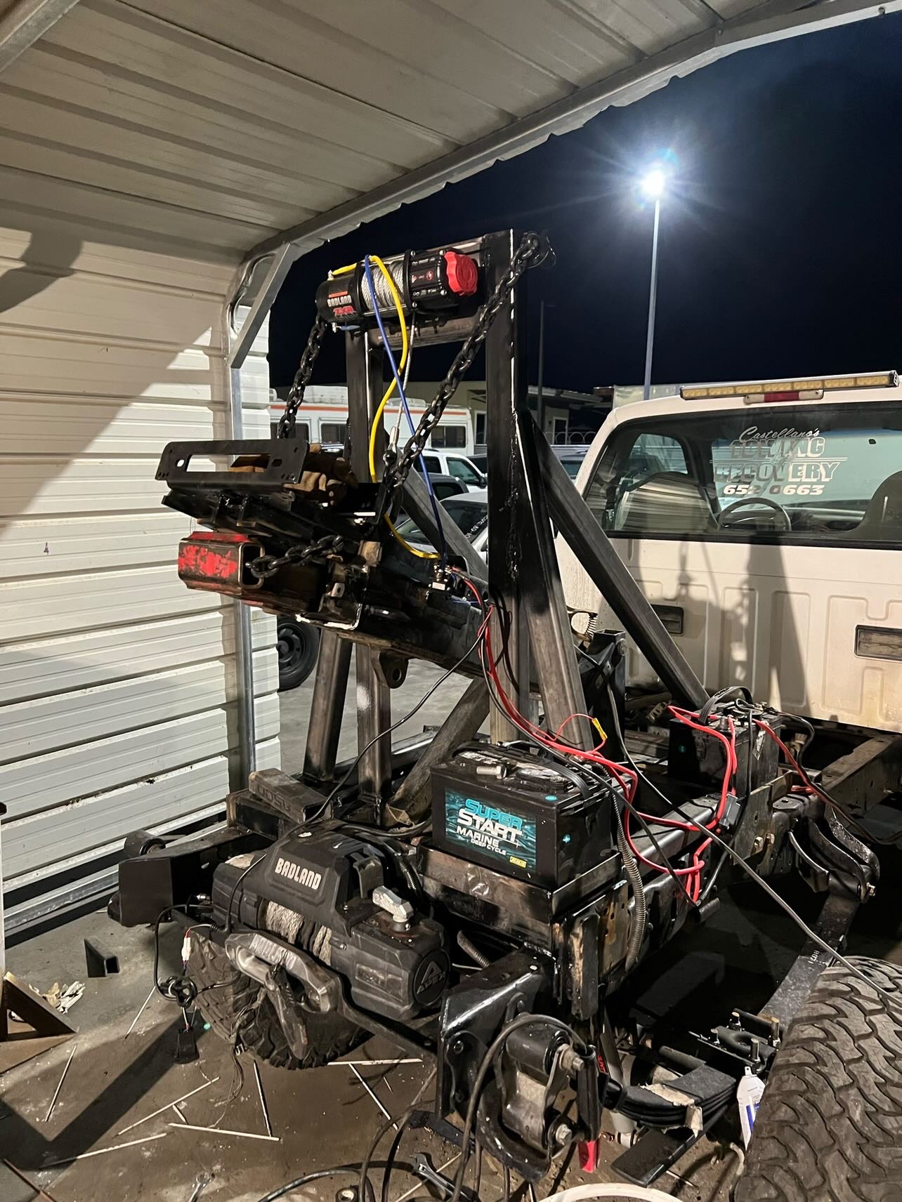 Custom metal fabricated truck-mounted hydraulic hoist with electric winch, structural welding by SoCal professional welders