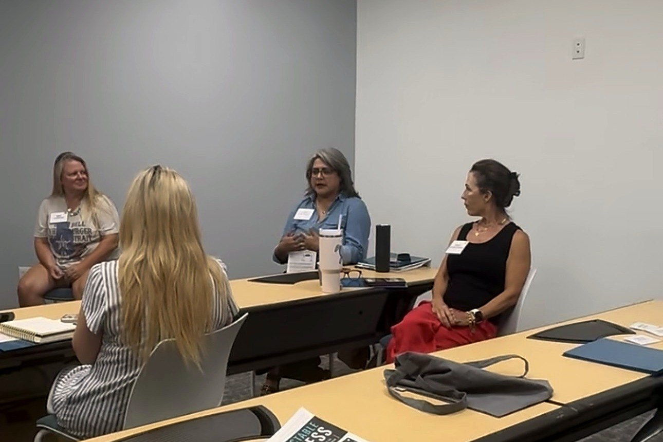 Members sharing ideas at a book club session