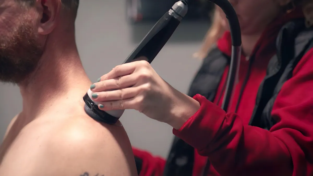 StemWave treatment on the muscle above a man's shoulder blade